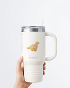 Hand holding a tumbler displaying a Nuts & Lemons Co. diecut sticker featuring a Dino nug with the phrase “you are Dino-mite”