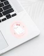 Laptop displaying a Nuts & Lemons Co. diecut sticker featuring a cute ghostie with a pink bow surrounded by heart cherries with the phrase “lookin’ faboolous”