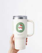 Hand holding a tumbler displaying Nuts & Lemons Co. diecut sticker featuring a cute ghostie with books, Santa hat and scarf  with the phrase “ghoul’d reads”