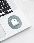 Laptop displaying a Nuts & Lemons Co. diecut sticker featuring a cute annoyed ghostie with the phrase “keep the boo sheet”