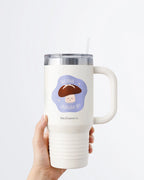 Hand holding a tumbler displaying Nuts & Lemons Co. diecut sticker featuring a calm shiitake mushroom with the phrase “let that shiitake 