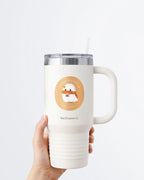 Hand holding a tumbler displaying Nuts & Lemons Co. diecut sticker featuring a cute ghostie with autumn books, scarf and psl with the phrase “pumpkin spice ghoulie”