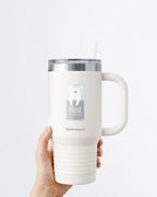 Hand holding a tumbler displaying Nuts & Lemons Co. diecut sticker featuring sleeping polar bear with the phrase “rest is productive”