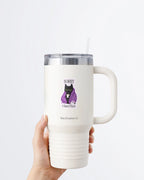 A hand holding a white tumbler with a Nuts & Lemons Co. diecut sticker on it featuring a black cat in a starry blanket holding a mug and crystals with the phrase “Sorry I Have Plans”