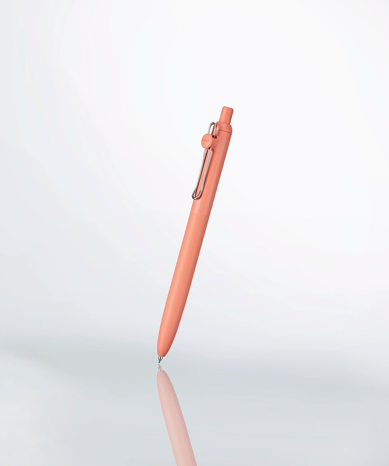 a uniball zento pen in color terra cotta