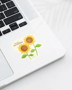 Laptop with a Nuts & Lemons Co. diecut sticker featuring a two sunflowers with the phrase “You Are My Sunshine”