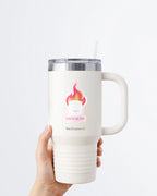 Hand holding a tumbler displaying Nuts & Lemons Co. diecut sticker featuring a marshmallow on fire with the phrase “you’re on fire”